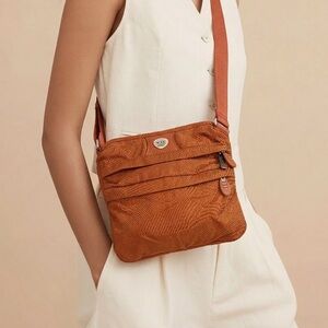 Tumi orange multiple zipper crossbody bag